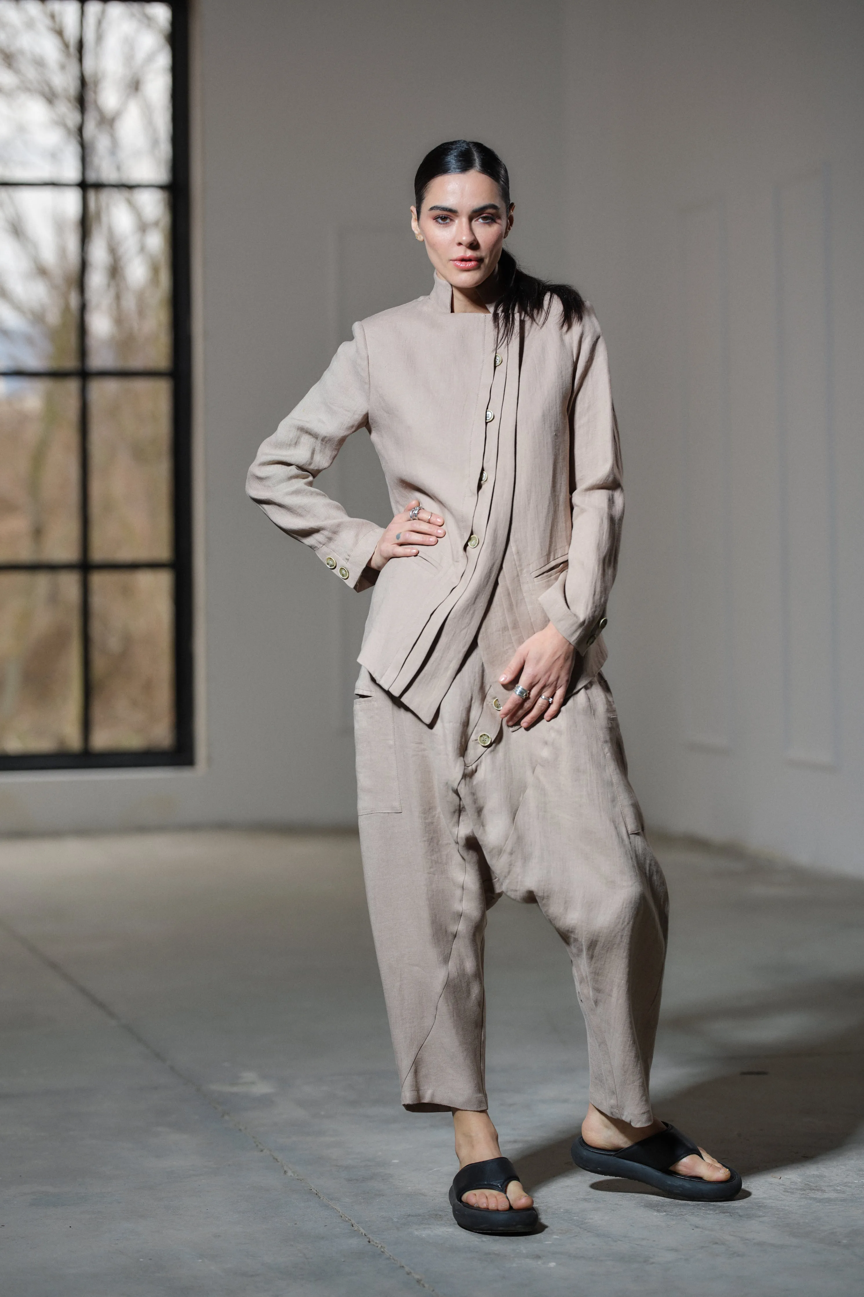 Avant garde linen blazer featuring asymmetrical button closure